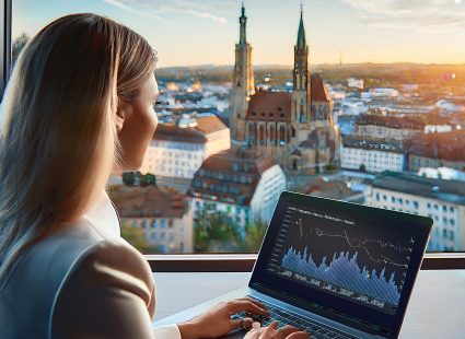 Geschäftsmann analysiert Website-Traffic und SEO-Strategien vor der Skyline von Braunschweig.